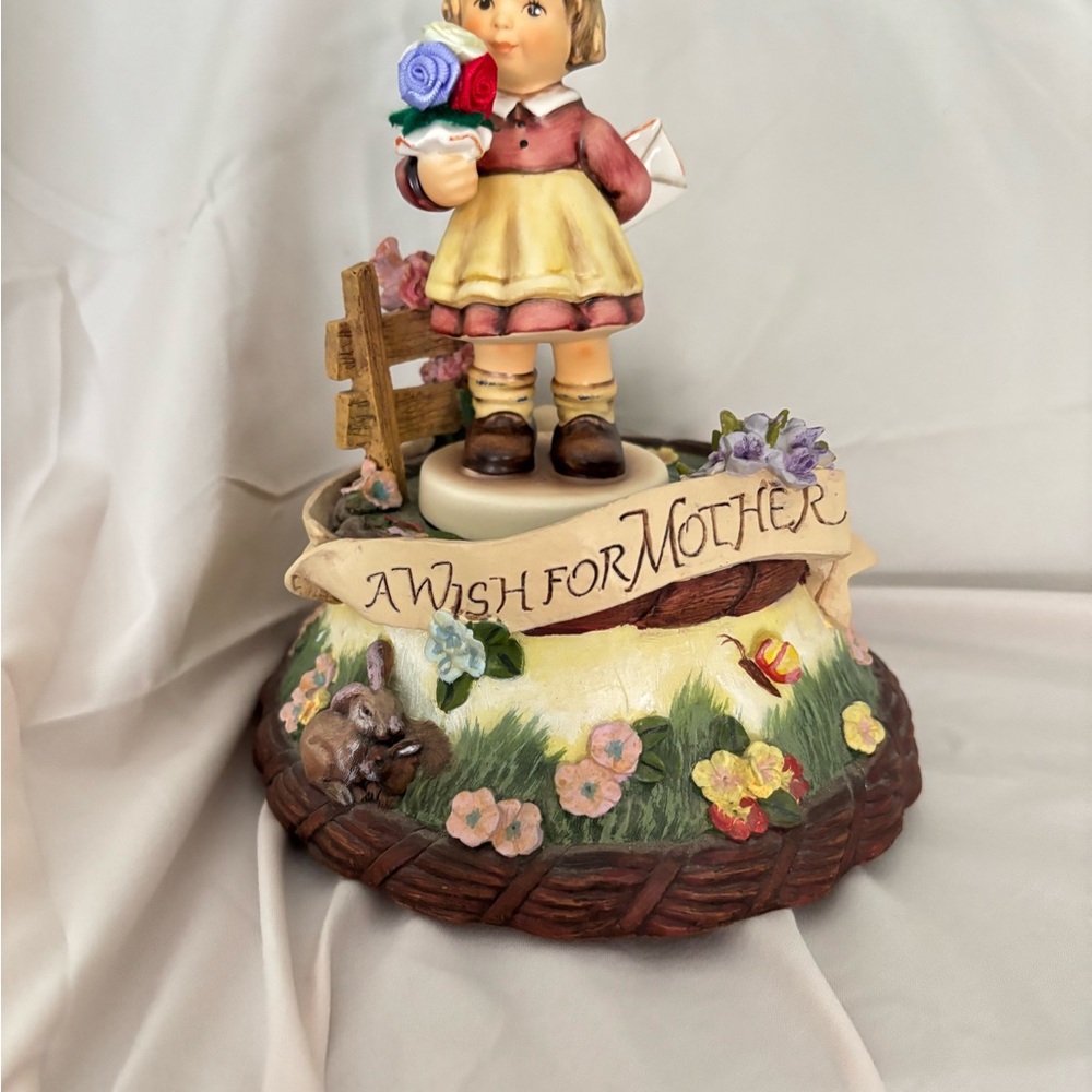 Goebel Hummel a wish for Mother . Plays I Just called to say I Love you